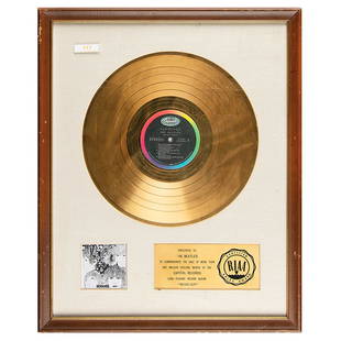 Beatles RIAA Sales Award for 'Revolver': Rare and important white-matte RIAA gold record sales award presented "to The Beatles to commemorate the sale of more than one million dollars worth of the Capitol Records long-playing record album