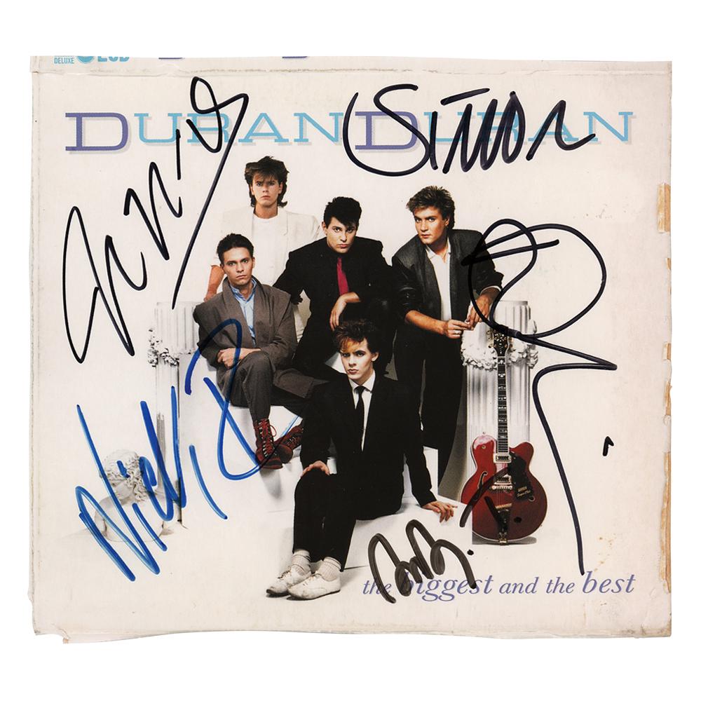 Duran Duran Signed CD Sleeve: The Biggest And The Best CD cover, signed in felt tip by Nick Rhodes, John Taylor, Andy Taylor, Roger Taylor, and Simon Le Bon. In fine condition, with light wear to the sloppily trimmed edges.