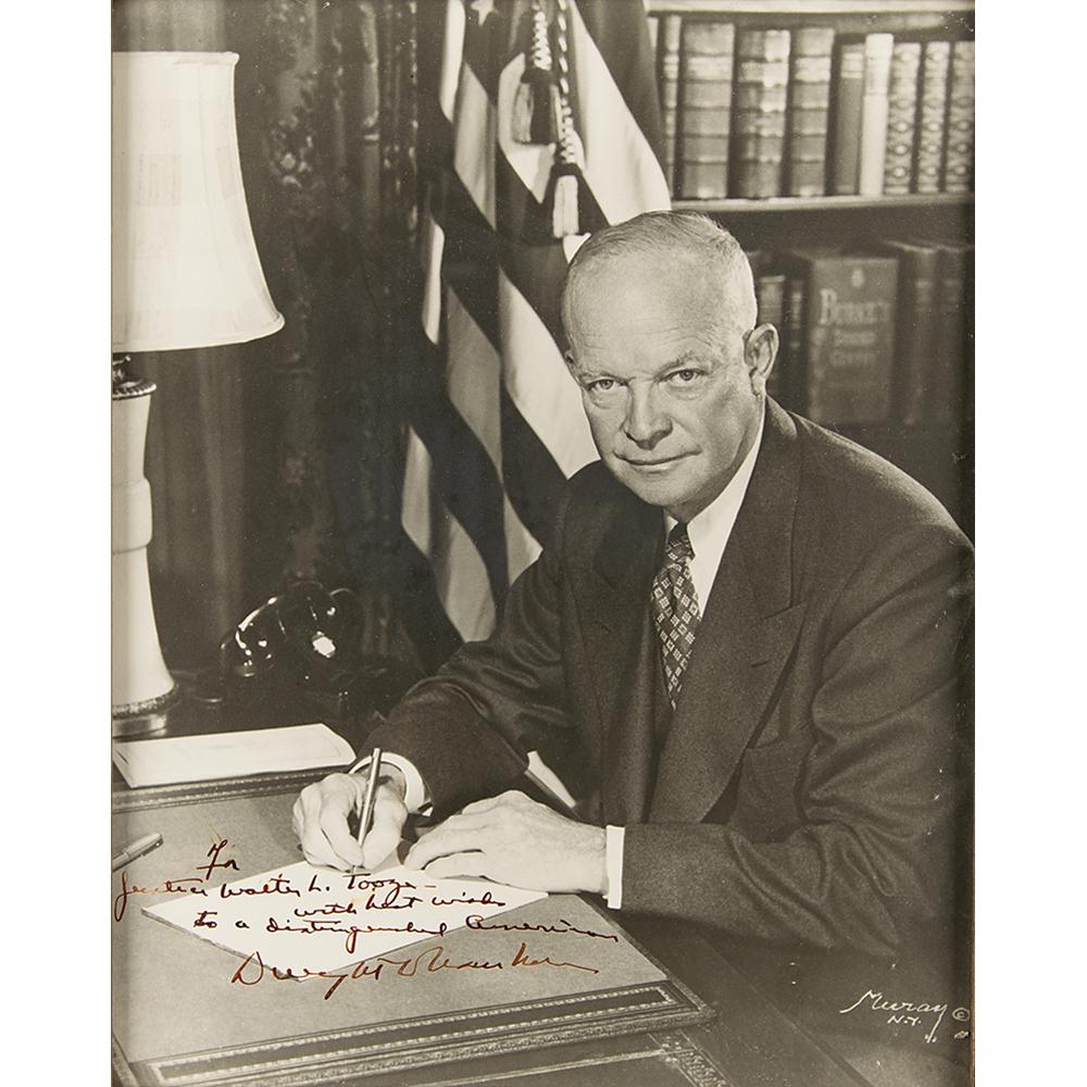 Dwight D. Eisenhower Signed Oversized Photograph: Vintage matte-finish 10.2 x 13.25 Nickolas Muray photo of President Eisenhower seated at his desk, signed and inscribed in fountain pen, "For Justice Walter L. Tooze—with best wishes to a distin