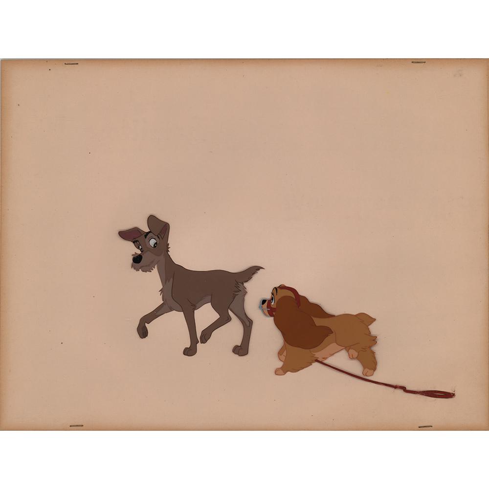 Lady and Tramp production cels from Lady and the Tramp: (Walt Disney Studios, 1955) Original production cels of the title characters from Lady and the Tramp, which shows the canine couple walking together in large full-length poses, with Lady wearing her m