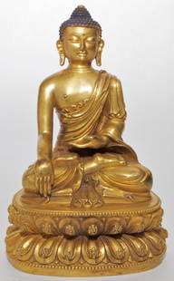 Gilt Bronze Buddha: Seated figure of Amitabha atop a double-lotus throne, his right hand in bhumisparsa and his left in dhyana mudra, with base plate. The robe draped over the left shoulder and fully extending down the