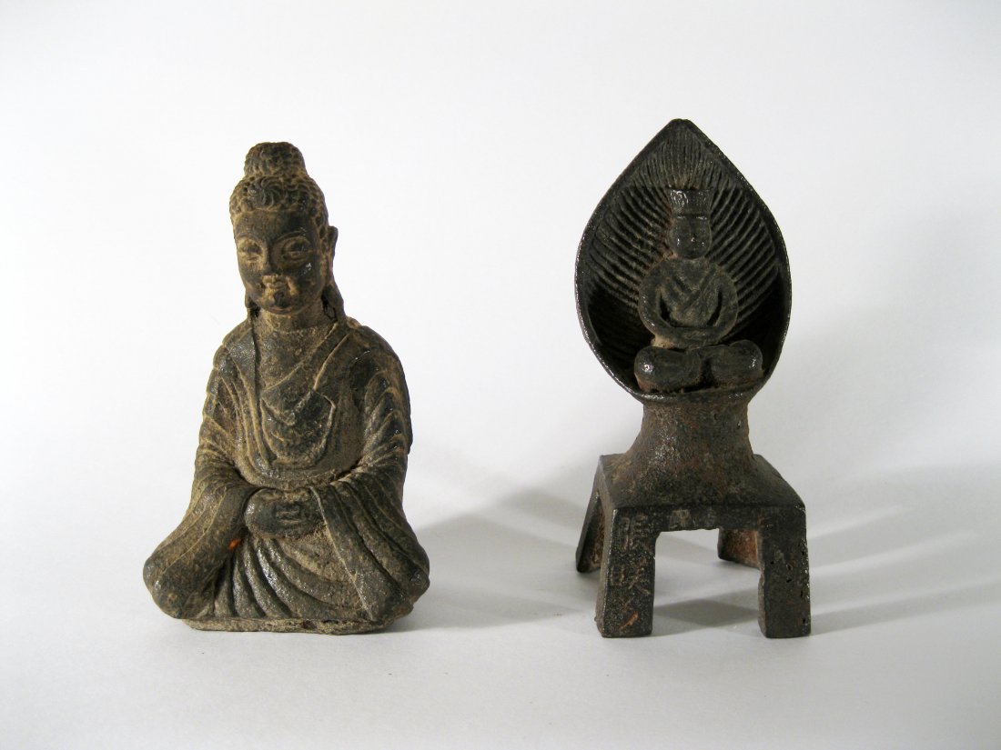 Two Antique Iron Buddhas, Wei Dynasty or Later: Two Antique Iron Buddhas, Wei Dynasty or Later. The first seated in dhyanasana with his robe draped around his shoulders and falling in heavy pleats to his wrists, his hair drawn up and tied, his face