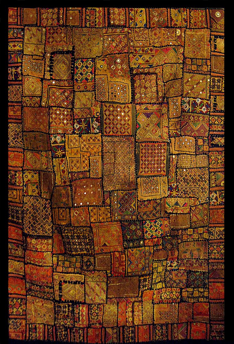 Antique Southeast Asian Textile: Antique Southeast Asian Textile, with various geometric designs, reflective mirrors and framed with a black border. Size: approximately 62 x 32 Inches (157 x 81 cm).