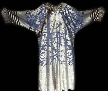 Silk Brocade Nine Dragon Robe, Qing Dynasty: Chinese Silk Brocade Nine Dragon Robe, Qing Dynasty. Silver thread on a blue ground with nine five-clawed dragons and auspicious symbols. Length: 54 inches (137 cm) Width: 80 inches (203 cm) Provenanc