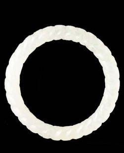 Fine White Jade Rope Bangle: Fine White Jade Rope Bangle. Well polished white colored translucent stone, with rope twist carving. Inner diameter: 2.4 inches (6.1 cm)