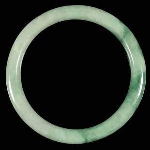 Translucent Green Jadeite Bangle: Translucent green jadeite bangle. Finely polished. Inner Diameter: 2.2 inches (56 mm)