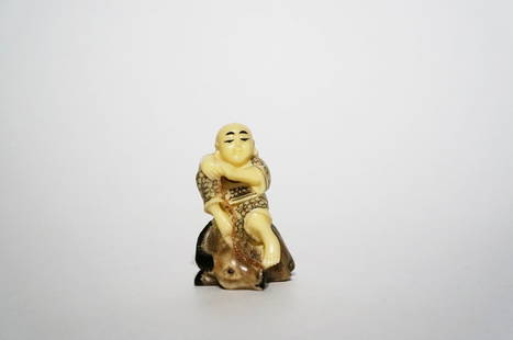 Antique Polychrome Ivory Netsuke: Antique Polychrome Ivory Netsuke. Finely carved and polished netsuke of a boy on a stag. Height: 2 inches (5.1 cm)