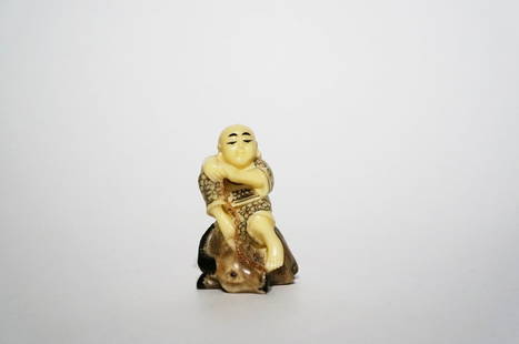 Antique Polychrome Ivory Netsuke: Antique Polychrome Ivory Netsuke. Finely carved and polished netsuke of a boy on a stag. Height: 2 inches (5.1 cm)