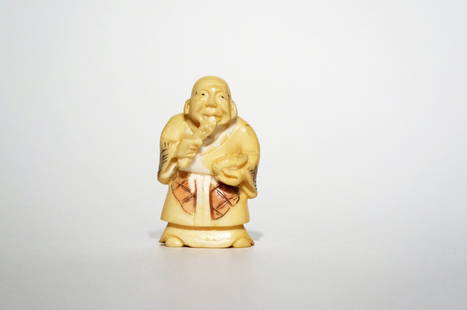 Antique Polychrome Ivory Netsuke: Antique polychrome ivory netsuke of an old man. Height: 2 inches (5.1 cm)