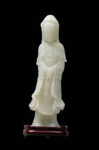 Large White Jade Guanyin Figure, early 20th Century: Large White Jade Guanyin Figure, early 20th Century. The translucent stone exquisitely carved in the form of the Goddess of Compassion standing in a composed manner in long flowing robes holding a