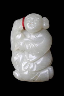 White Jade Carving of a Boy: White Jade Carving of a Boy. The translucent stone with good polish. Height: 2 inches (5.1 cm)