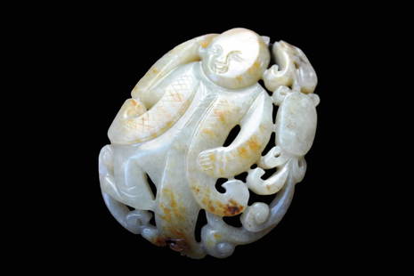 White and Russet Jade Boy Pendant: White and russet Jade boy Pendant. The stone of white tone with areas of russet. Measurement: 2.16 x 1.65 inches (5.5 x 4.2 cm)