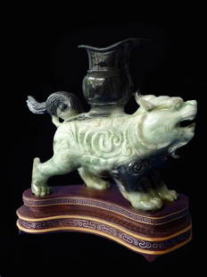 Large Jade Mythical Beast Carving: Large Jade Mythical Beast Carving. Good mottled green jade carving of a mythical beast with a small vase attached. Very finely detailed with good oily polish. Measurement (without base): 7.5 x