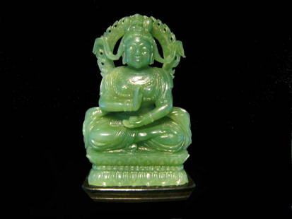 Fine Green Jade Figure of Guanyin, Sotheby's: Fine Green Jade Figure of Guanyin, Sotheby's. Qing Dynasty. Shown seated in Dhyasana on a double lotus throne, attired in long flowing robes, holding an alms bowl and adorned with a jeweled necklace.