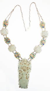 Fine 19th Century Chinese Jade export necklace: Fine 19th Century Chinese Jade export necklace. The centerpiece of fine white jade carved in the shape of a vase and flowers and mounted on silver filigree. The necklace with 4 white jade oval