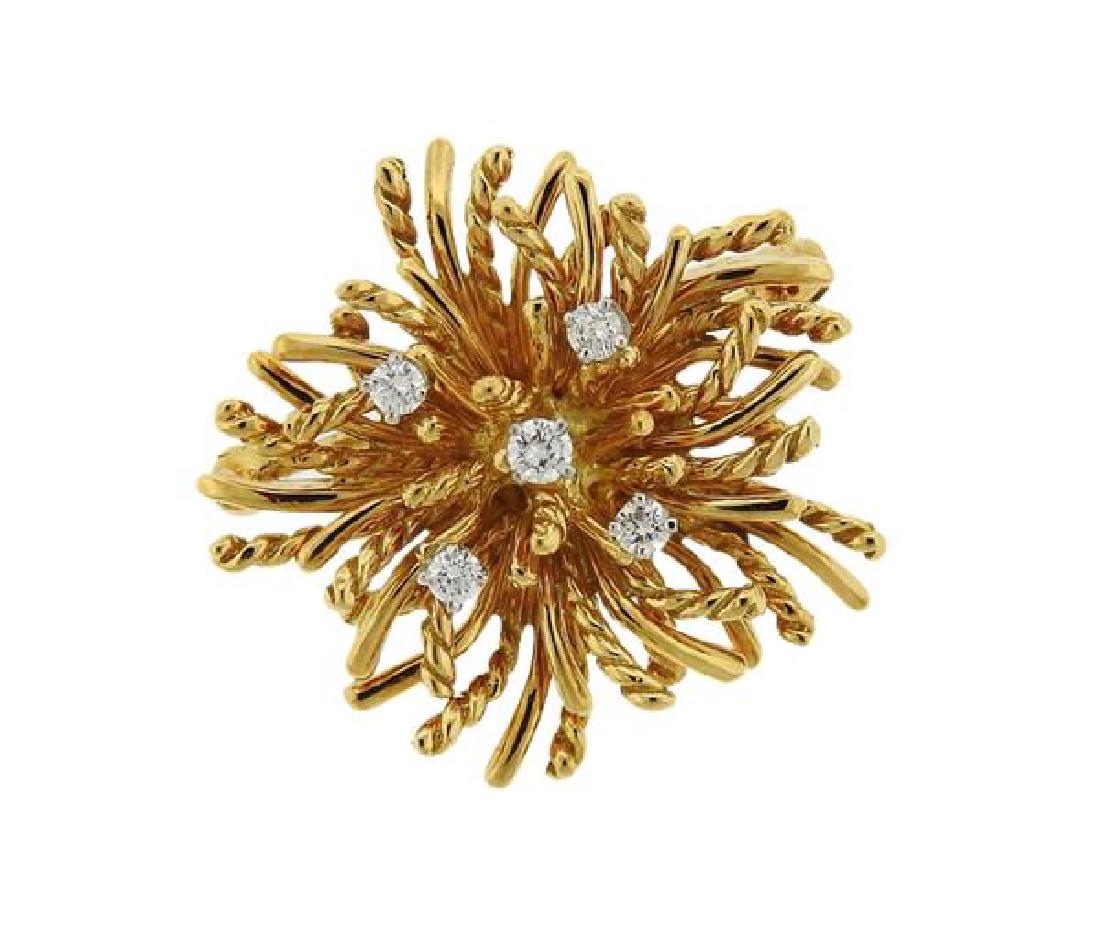 Tiffany & Co 18k Gold Diamond Anemone Brooch Pin: METAL: 18k gold. MEASUREMENTS: brooch is 25mm x 26mm. GEMSTONES: diamonds approx. 0.16ctw. Comes with pouch. MARKED: Tiffany & Co, 750. WEIGHT: 8.9 grams.Gemstones have not been graded for color a
