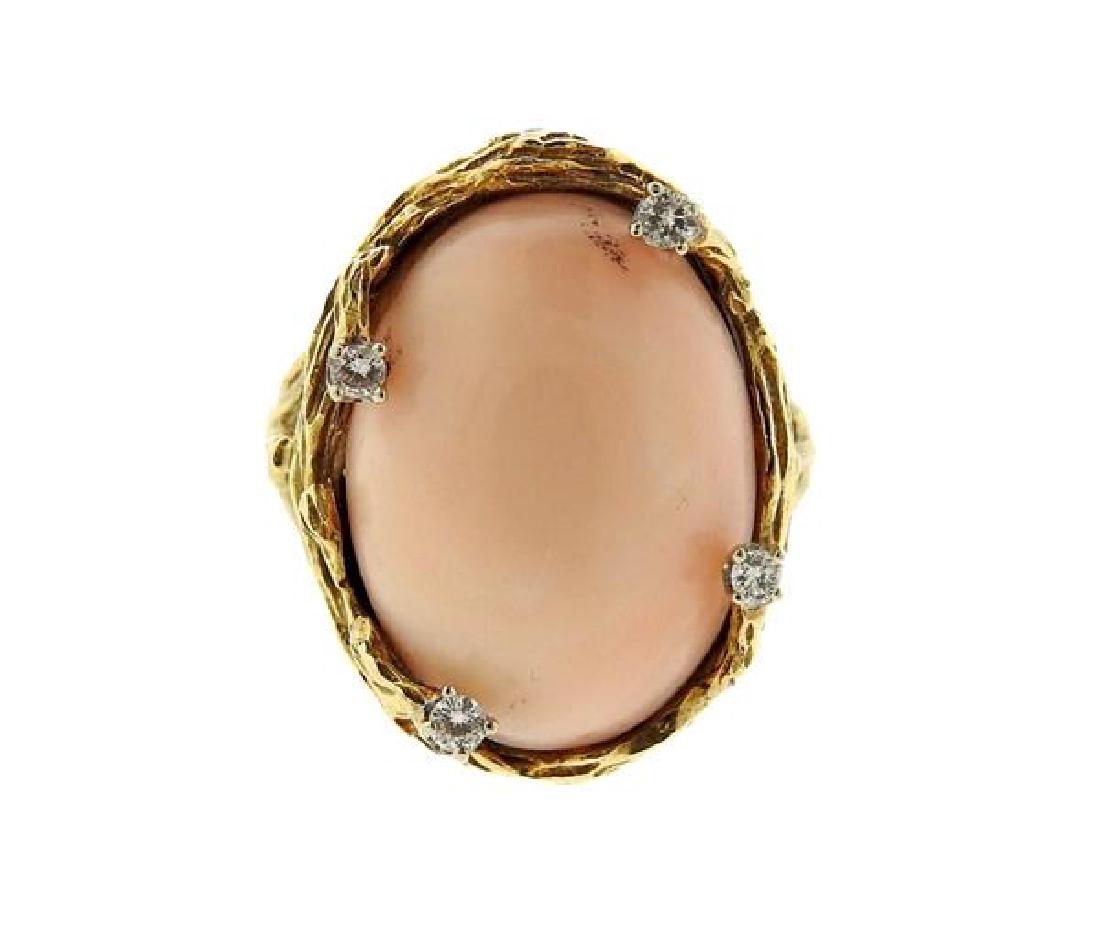 1970s 14k Gold Coral Diamond Ring: METAL: 14k gold. MEASUREMENTS: ring size - 7, ring top is 22mm x 18mm. GEMSTONES: angel skin coral, diamonds approx. 0.10ctw. MARKED: 14k. WEIGHT: 10.1 grams.Gemstones have not been graded for color a