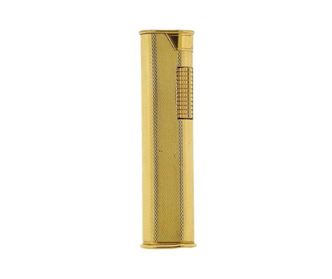 Dunhill Gold Tone Lighter: METAL: gold tone metal. MEASUREMENTS: overall dimensions 73mm x 18mm x 14mm. Lighter sparks, but does not light up. WEIGHT: 63.9 grams.Gemstones have not been graded for color and clarity ,and tested