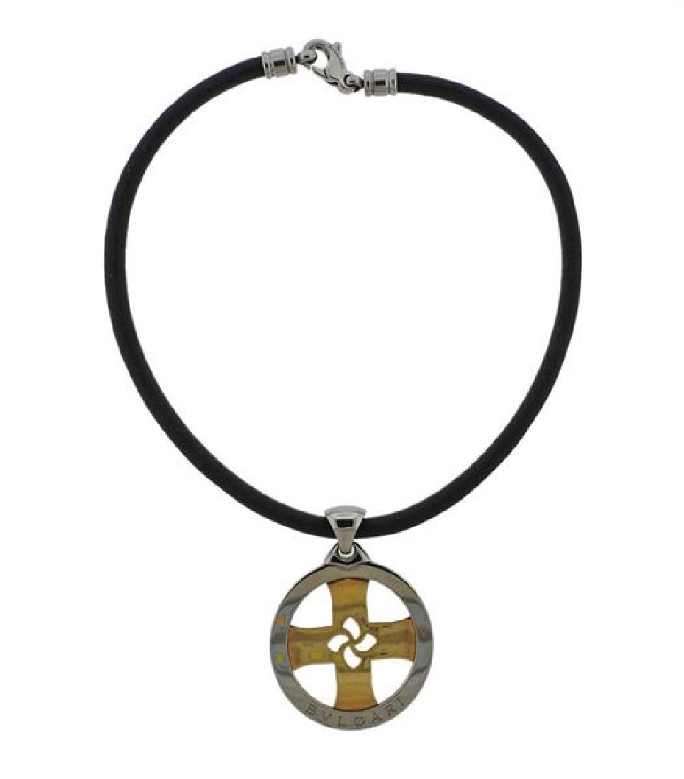 Bvlgari Bulgari Tondo Steel 18k Gold Leather Pendant: METAL: 18k gold/ stainless steel/ leather cord. MEASUREMENTS: necklace is 15 1/2" long, pendant - 43mm in diameter. MARKED: steel and gold, made in Italy, 750, Bvlgari. WEIGHT: 36.3 grams.Gemston