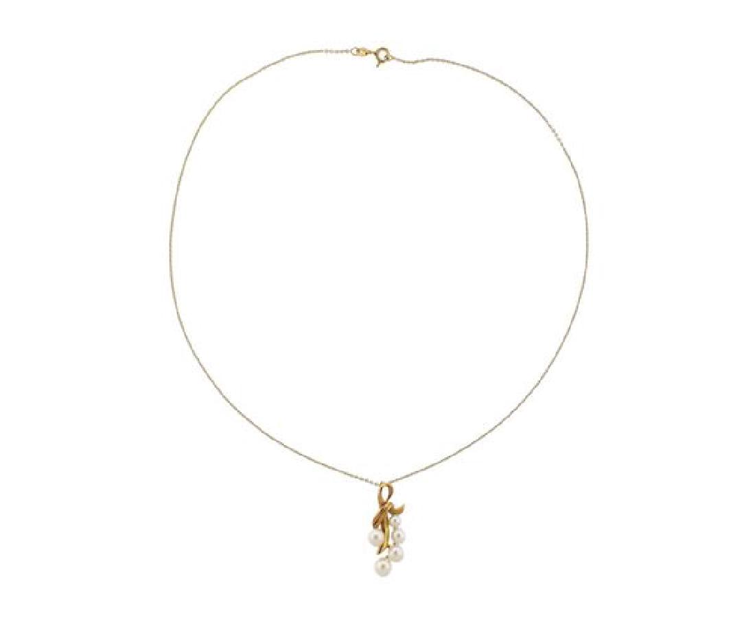 Mikimoto 14K Gold Pearl Pendant Necklace: METAL: 14K gold. GEMSTONES: pearls 4-5.7mm. MEASUREMENTS: pendant is 27mm x 13mm. Necklace is 17" long. MARKED: M 585. WEIGHT: 4.5 grams. Gemstones have not been graded for color and clarity ,and