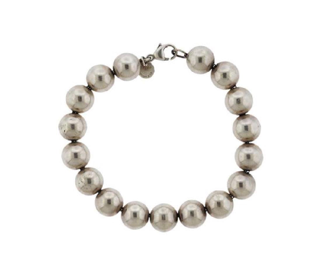 Tiffany & Co Sterling Silver Ball Bracelet: METAL: sterling silver. MEASUREMENTS: bracelet is 7 3/8" long, balls are 10mm in diameter. MARKED: Tiffany & Co, 925. WEIGHT: 19.4 grams.Gemstones have not been graded for color and clarity ,