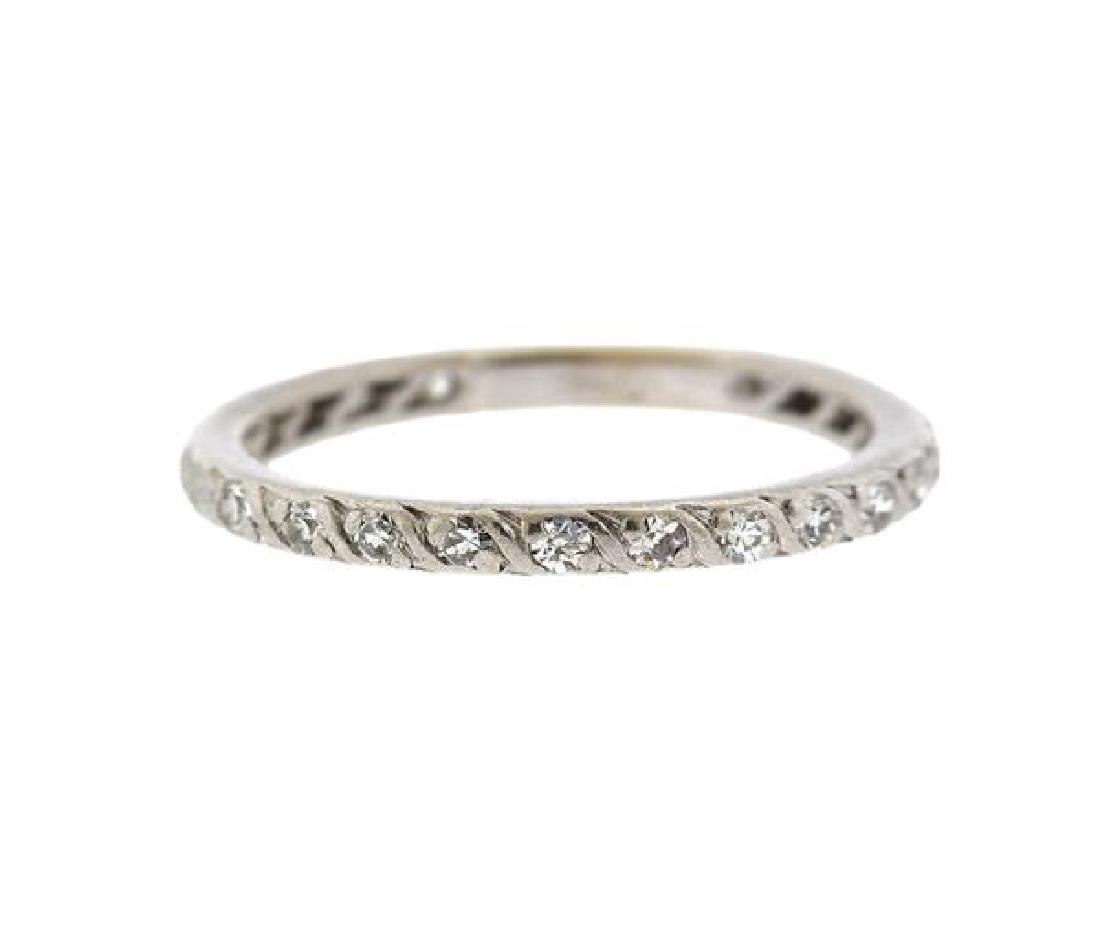 Platinum Diamond Wedding Band Ring: METAL: platinum. GEMSTONES: 21 diamonds (one stone chipped). MEASUREMENTS: ring size 9. Band is 2.3mm wide. TESTED: platinum. WEIGHT: 3.9 grams. Gemstones have not been graded for color and clarity ,a