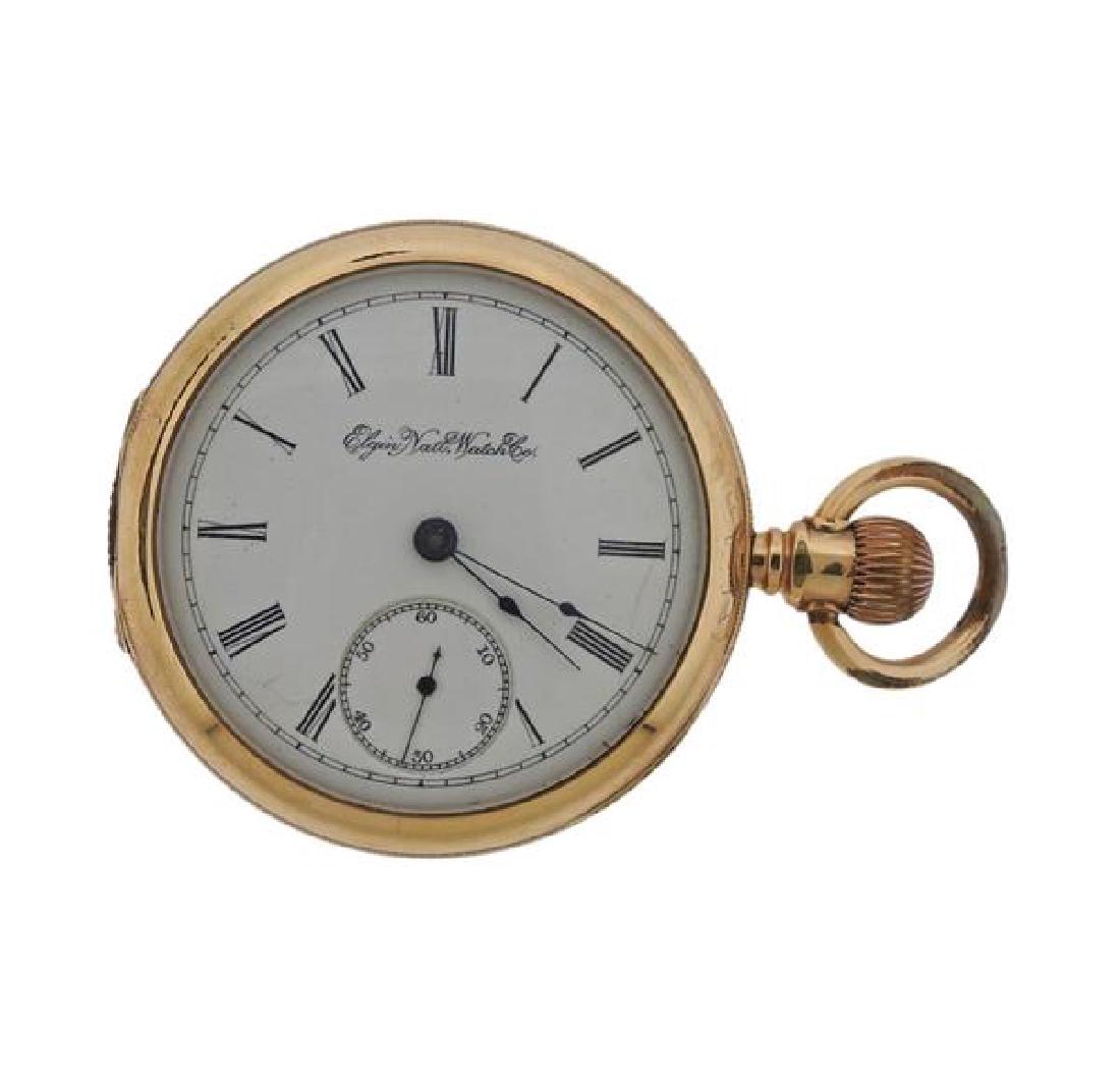 Elgin Gold Filled Pocket Watch: METAL: Gold Filled. MEASUREMENTS: Case - 53mm in diameter. Porcelain dial, with small second hand at 6 o'clock. Some hairlines , visible at 3 and 7 o'clock. MOVEMENT: Manual wind, running orde