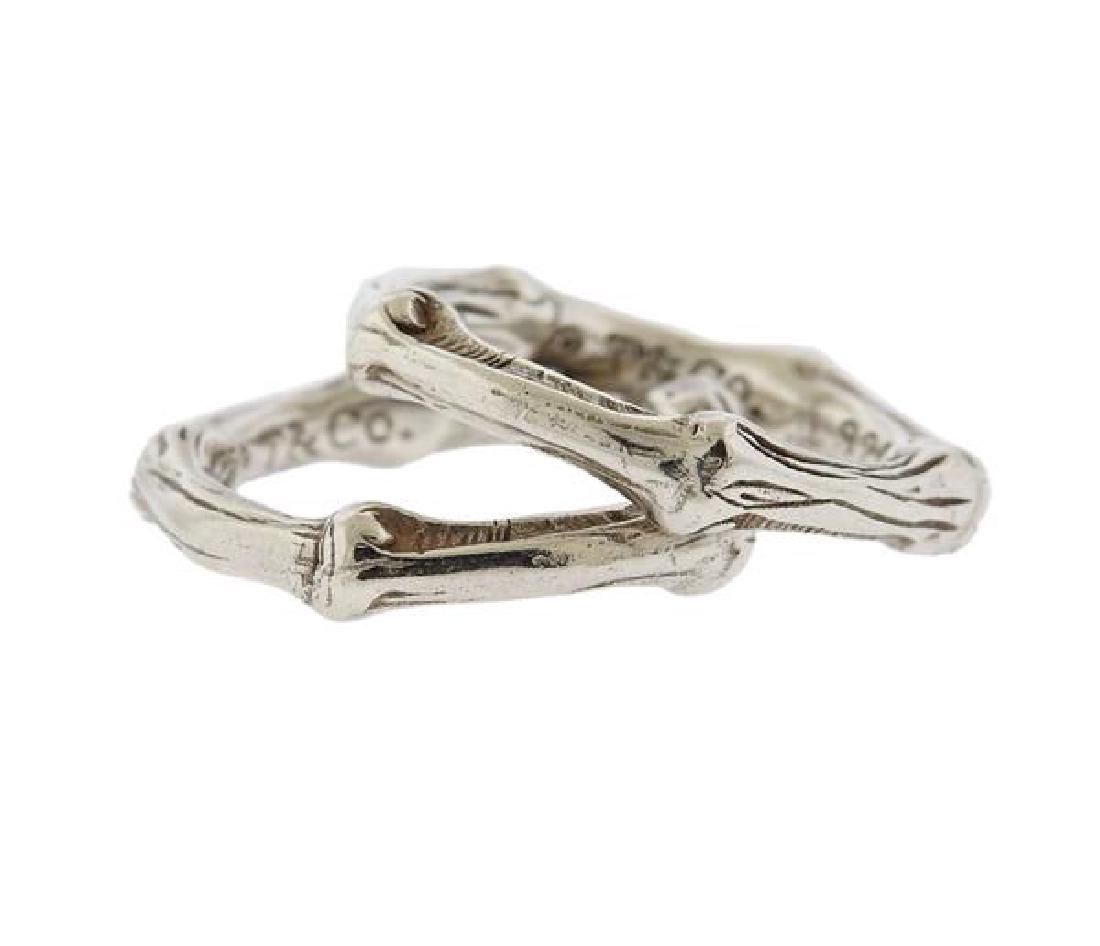 Tiffany & Co Bamboo Sterling Silver Ring Set of 2: METAL: Sterling Silver. MEASUREMENTS: Rings size is 6.5, each ring is 5mm wide. MARKED: 1996, T & Co, 925. WEIGHT: 11.1 grams.Gemstones have not been graded for color and clarity, and tested for c