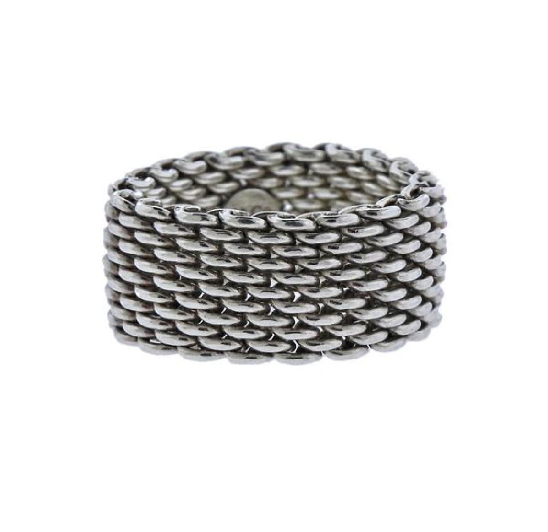 Tiffany & Co Somerset Sterling Silver Mesh Ring: METAL: sterling silver. MEASUREMENTS: ring size 6.75. Band is 10.5mm wide. MARKED: T& Co 925. WEIGHT: 8.7 grams.Gemstones have not been graded for color and clarity, and tested for clarity and col