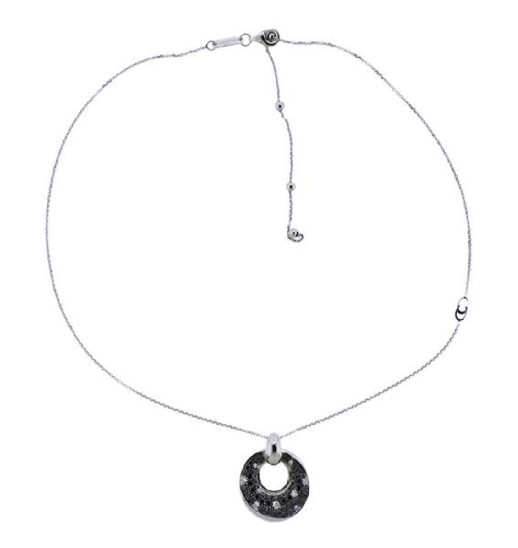 Chimento 18k Gold Black White Diamond Pendant Necklace: METAL: 18k Gold. MEASUREMENTS: Necklace is 18" long, Pendant - 20mm in diameter. GEMSTONES: White and black diamonds - approx. 0.75ctw. MARKED: Chimento, 24811, 750. WEIGHT: 9.4 grams.Gemstones h