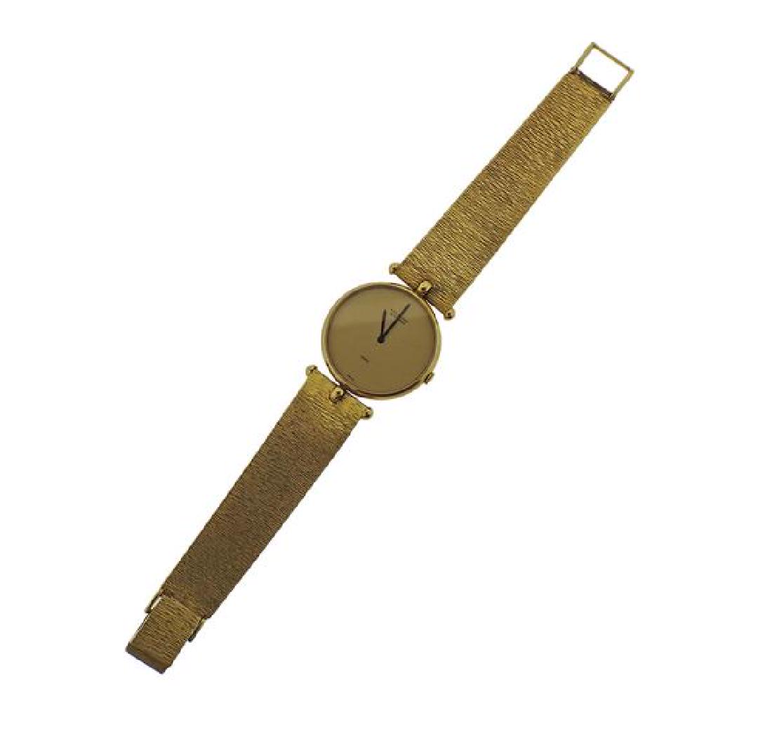 Van Cleef & Arpels 18k Gold Watch: METAL: 18k Gold. MEASUREMENTS: Case - 30mm excl crown. 18k gold band - 7" long. Gold tone dial with black hands. MOVEMENT: Quartz, not running. WEIGHT: 70 grams.Watches are guaranteed to be in ru