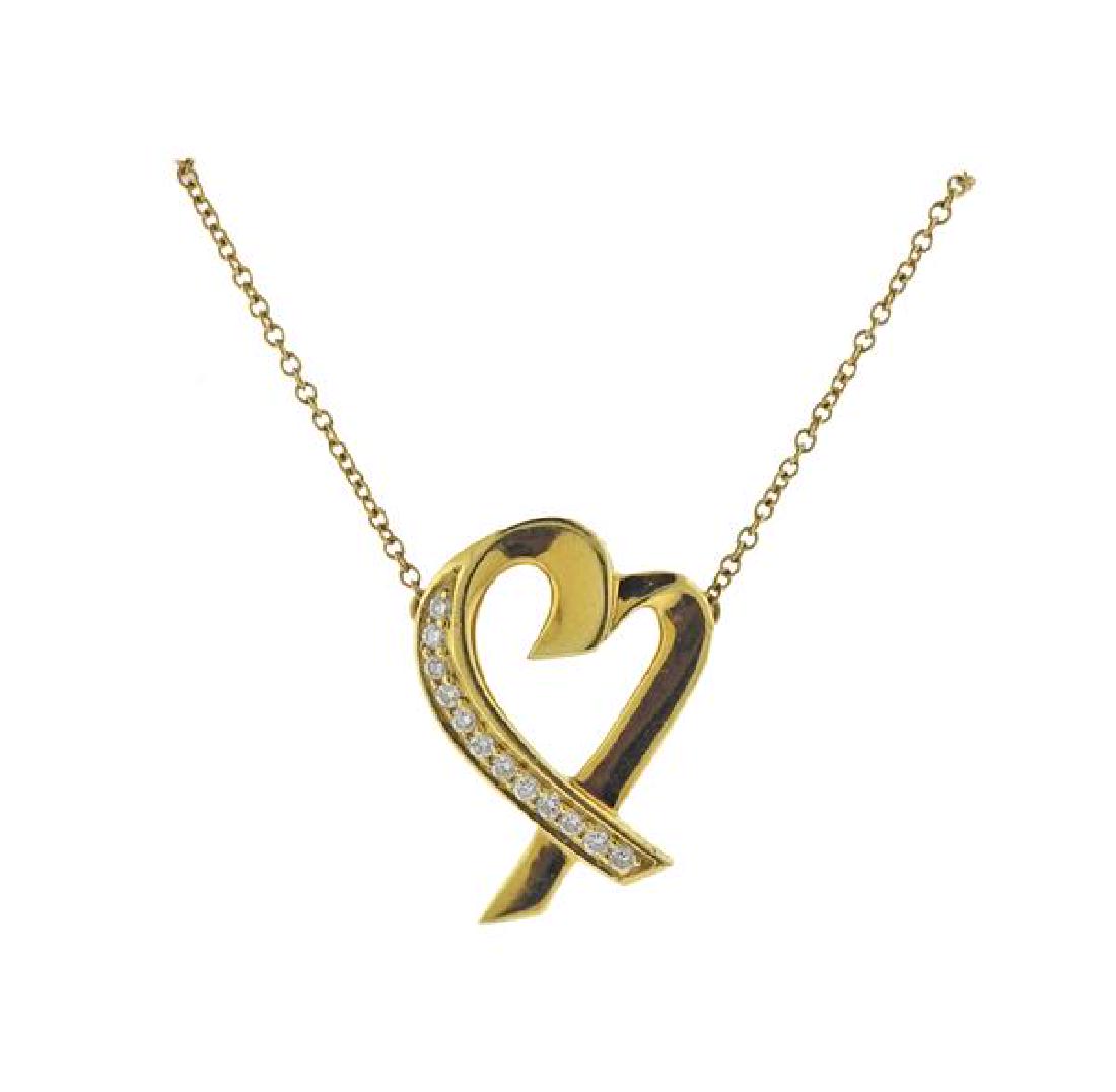 Tiffany & Co Picasso 18K Gold Diamond Heart: METAL: 18K gold. GEMSTONES: 12 diamonds. MEASUREMENTS: necklace is 18.5" long. Heart pendant is 21mm x 15.2mm at widest point. MARKED: T&Co Paloma Picasso 750. WEIGHT: 4.9 grams.Gemstones hav