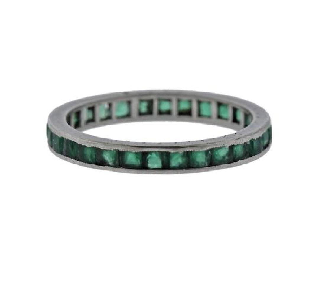 Platinum Green Stone Eternity Wedding Band Ring: METAL: Platinum. MEASUREMENTS: Ring size - 4.5, ring is 2.5mm wide. GEMSTONES: Green stones - full circle (some have chips). TESTED: Plat. WEIGHT: 1.4 grams.Gemstones have not been graded for color an