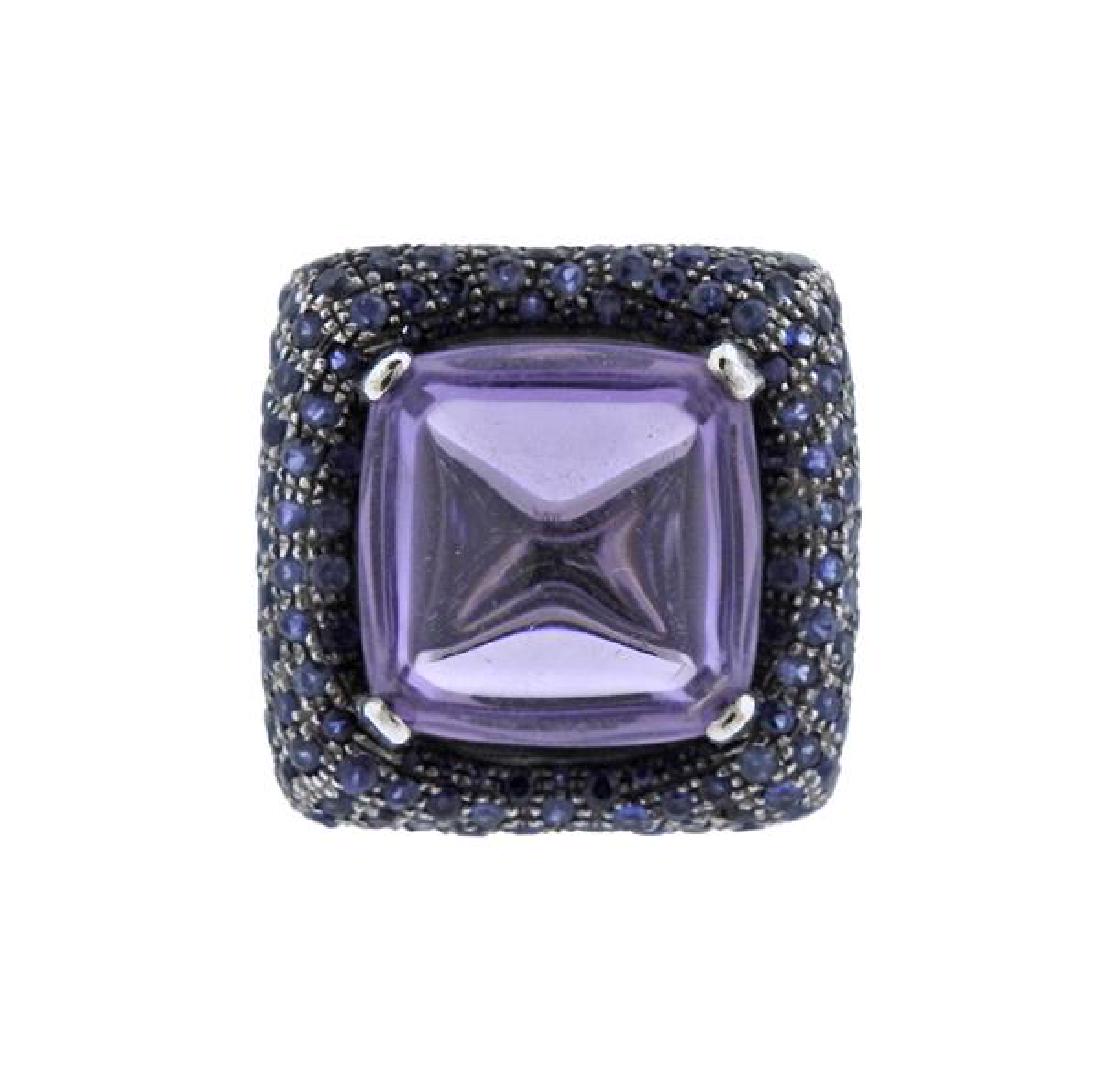 Pesavento 18k Gold Amethyst Sapphire Cocktail Ring: METAL: 18k Gold. MEASUREMENTS: Ring size - 6.5, ring top is 25mm x 26mm. GEMSTONES; Amethyst - 18mm x 18mm x 12mm, sapphires. Some stones are scratched/abraded. MARKED: Pesavento. WEIGHT: 30.4 grams.G