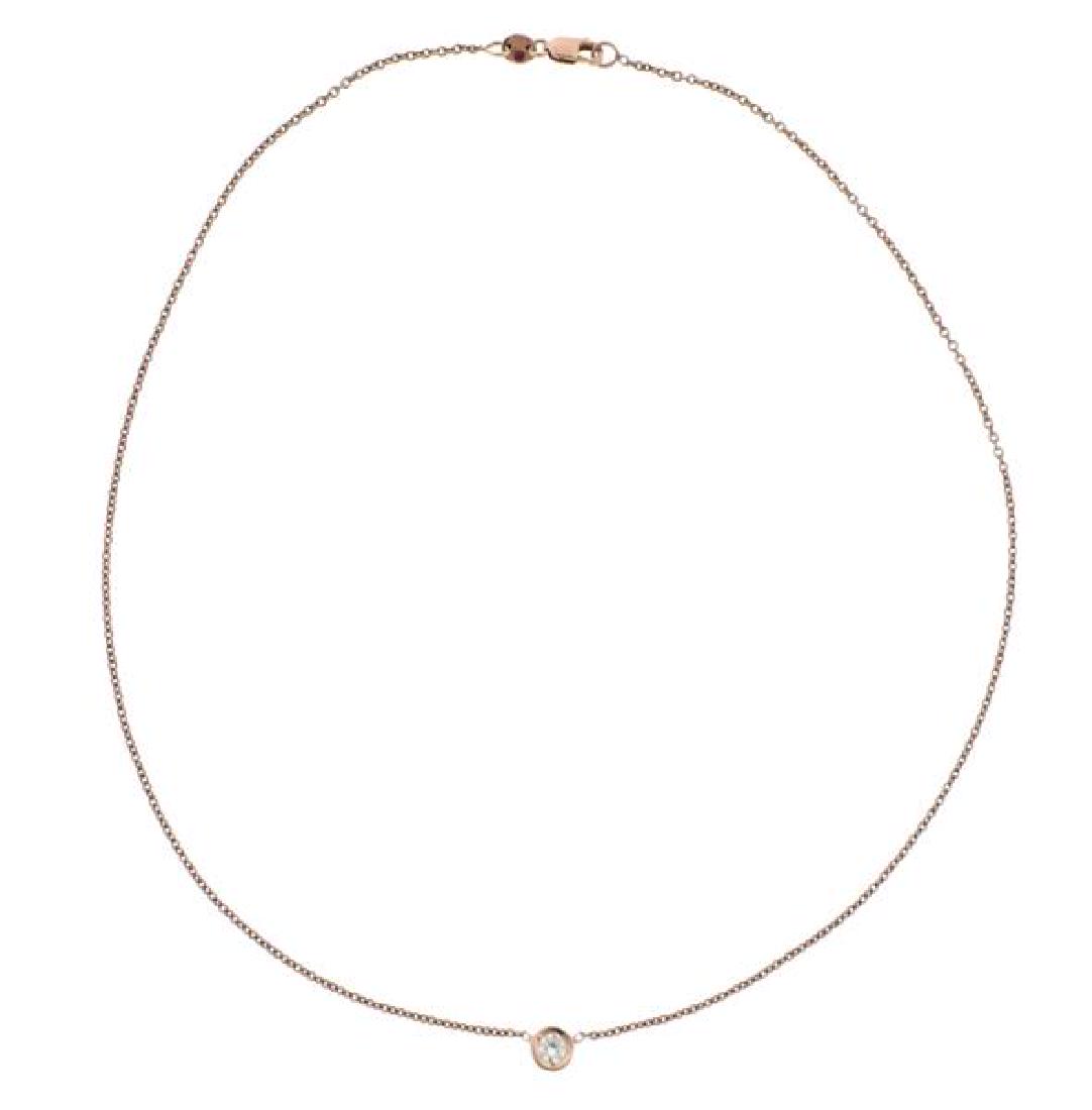 Roberto Coin 18K Rose Gold Single Diamond Neckklace: METAL: 18K rose gold. GEMSTONES: diamond-approx. 0.20ct. MEASUREMENTS: necklace is 16" long. Pendant is 6mm in diameter. MARKED: Maker's ruby hallmark, 750. WEIGHT: 3.6 grams. Retail $1300.Ge