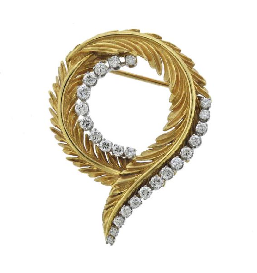 McTeigue 18K Gold Platinum Diamond Leaf Motif Brooch: METAL: 18K yellow gold, platinum. GEMSTONES: diamonds-approx. 0.80ctw. MEASUREMENTS: brooch is 41mm x 32mm at widest point. MARKED: Irid Plat 18K McT. WEIGHT: 13.7 grams.Gemstones have not been graded