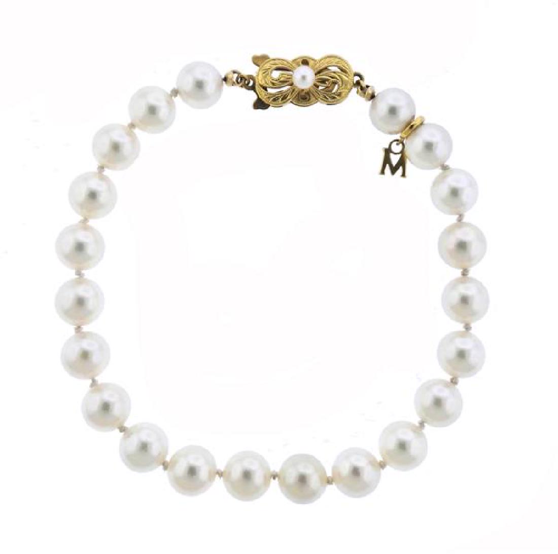 Mikimoto 7.5mm tto 8mm Pearl 18k Gold Bracelet: METAL: 18k Gold. MEASUREMENTS: Bracelet is 8.25" long. GEMSTONES: Pearls - 7.5mm - 8mm in diameter. MARKED: M hallmark, , M charm, 750. WEIGHT: 16.6 grams.Gemstones have not been graded for color