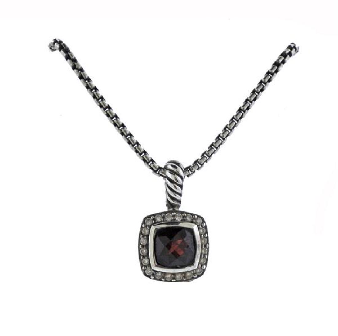 David Yurman Sterling Diamond Red Stone Pendant: METAL: sterling silver. GEMSTONES: diamonds, red stone. MEASUREMENTS: necklace is 17" long. Pendant is 20mm long x 11.5mm at widest point. MARKED: D.Y.925 Ag. WEIGHT: 9.7 grams.Gemstones have not