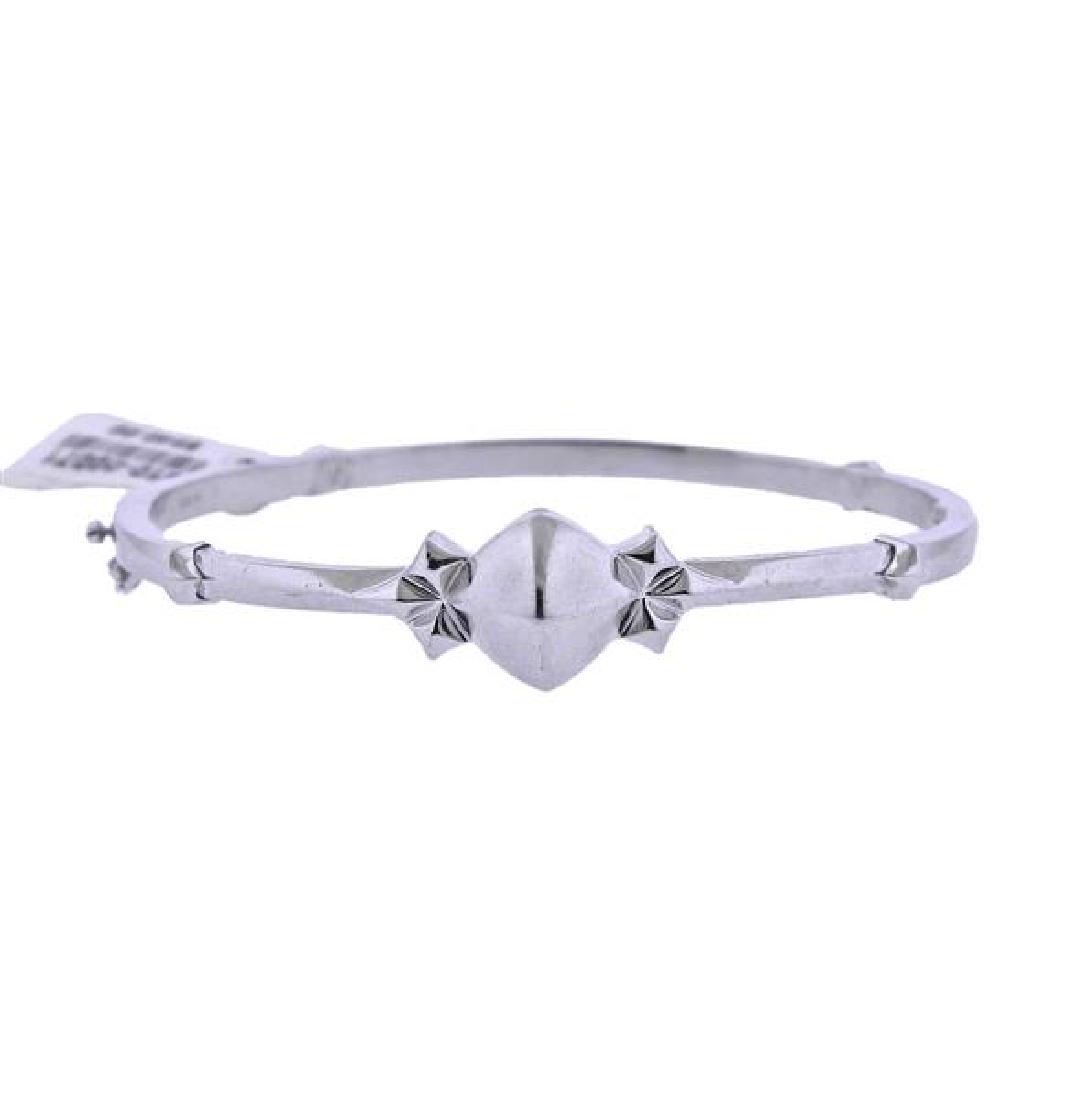 Stephen Webster Sterling Silver Bracelet: METAL: Sterling Silver. MEASUREMENTS: Bracelet will fit approx. 6.75" wrist, widest point - 12mm. MARKED: 925, maker's hallmark. WEIGHT: 13.6 grams. Retail $540.Gemstones have not been graded