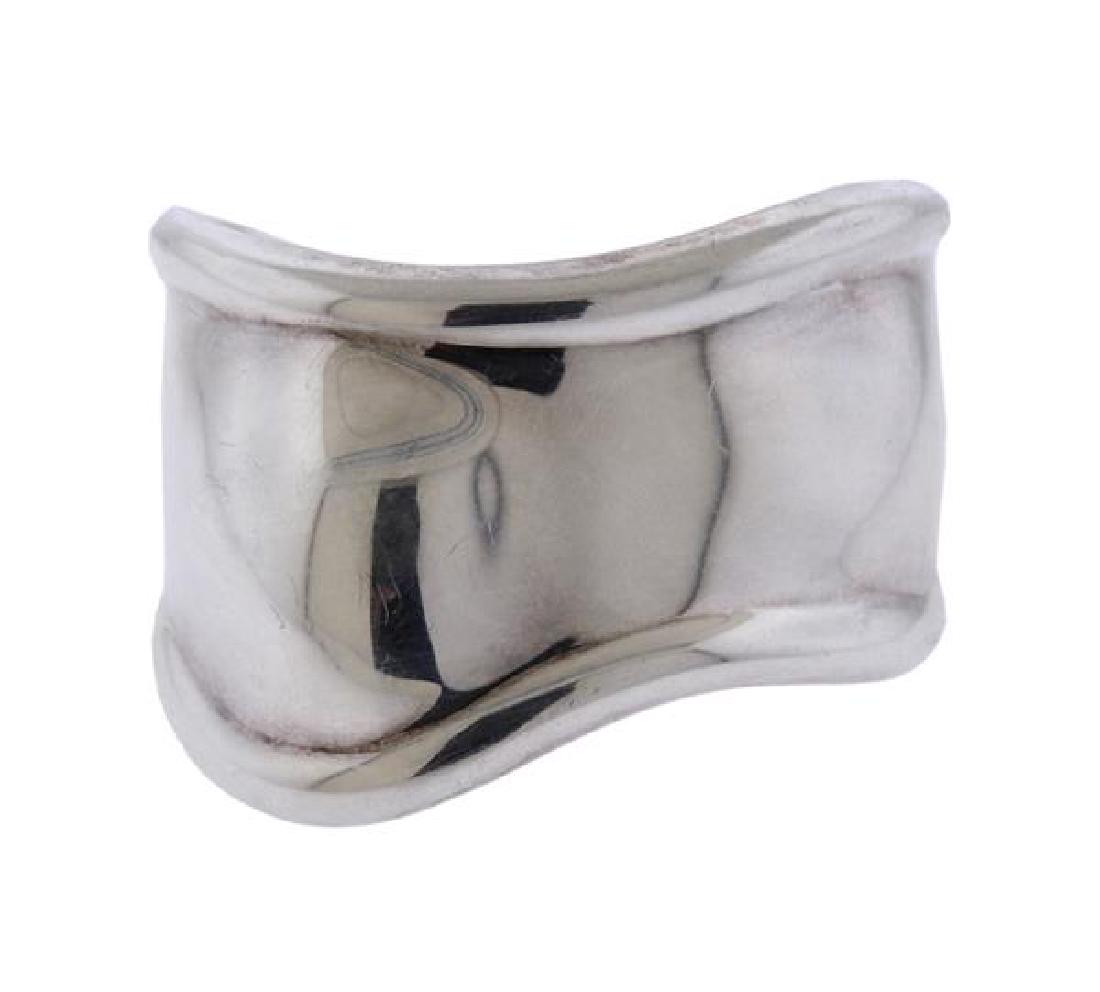 Tiffany & Co Elsa Peretti Sterling Bone Cuff: METAL: sterling silver. MEASUREMENTS: bracelet will fit up to 6.5" wrist and is 40mm at widest point. Bracelet is for the right wrist. MARKED: Tiffany & Co Alsa Peretti Ag925 Italy. WEIGHT: 5
