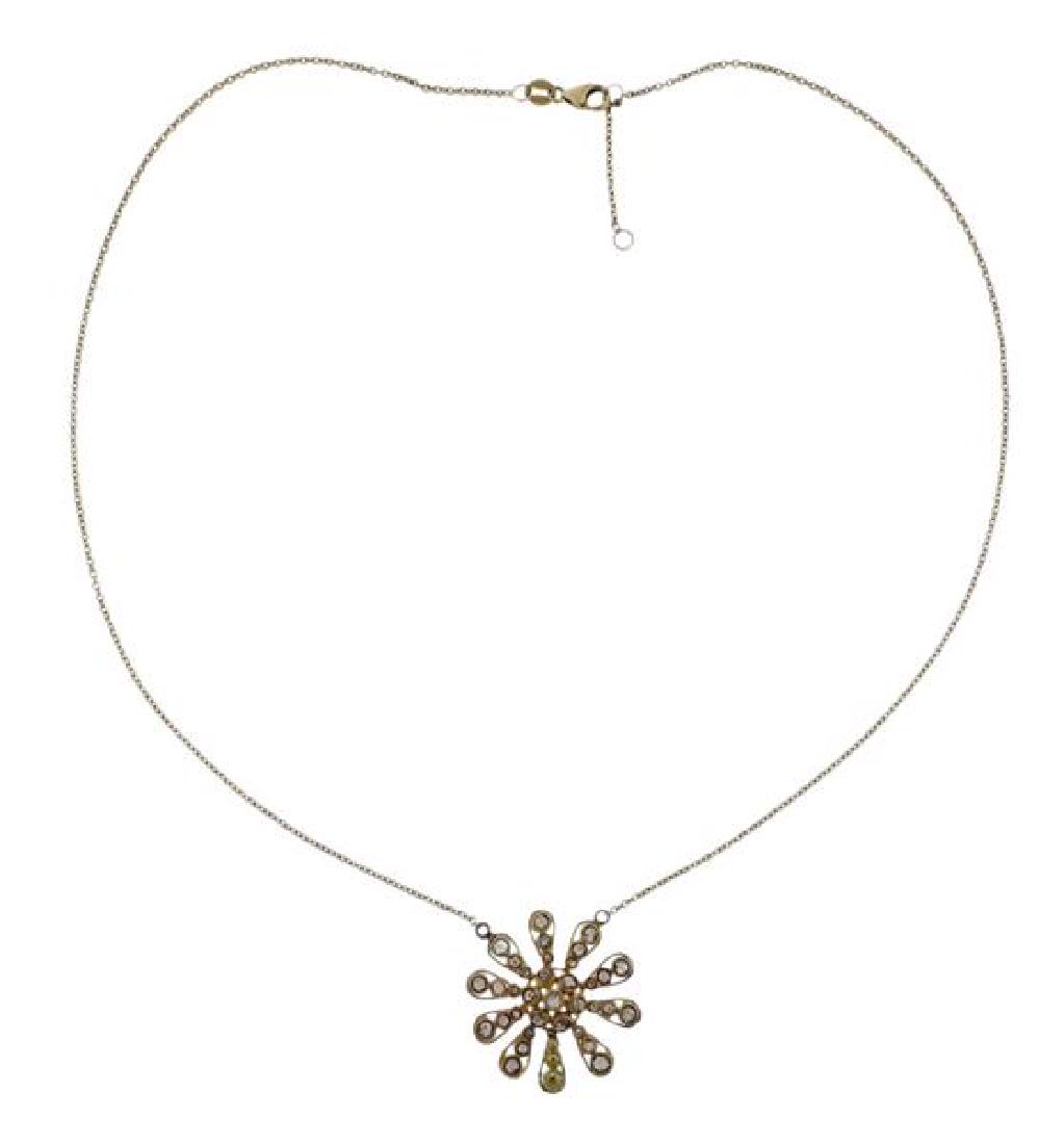 14K Gold Rose Cut Diamond Flower Pendant Necklace: METAL: 14K gold. GEMSTONES: rose cut diamonds. MEASUREMENTS: necklace is 16.5"long. Pendant is 25mm in diameter. MARKED: 14K Indonesia RCI. WEIGHT: 5 grams.Gemstones have not been graded for colo