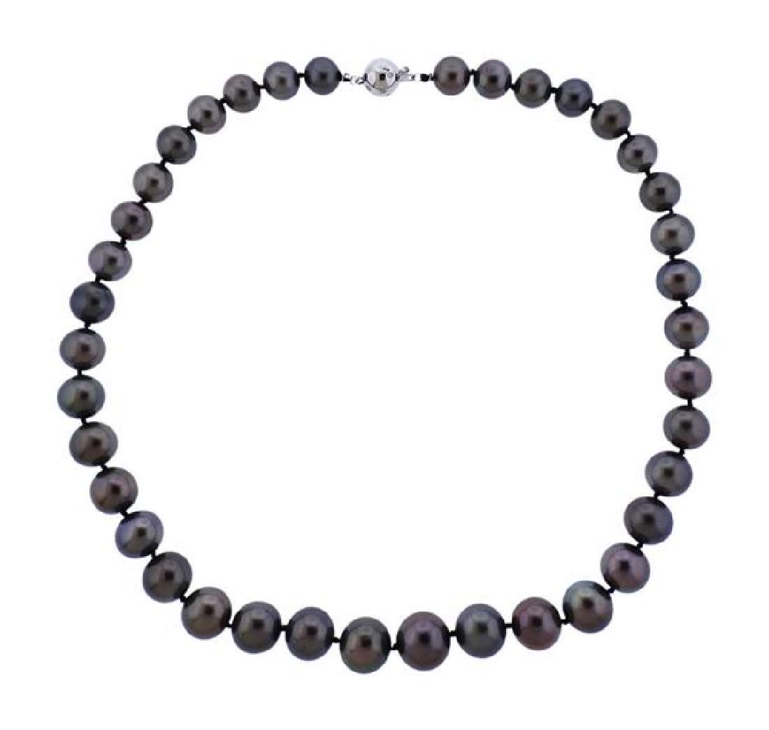 14K Gold Diamond Tahitian Pearl Graduated Bead Necklace: METAL: 14K gold. GEMSTONES: diamonds, Tahitian pearls 9.2-13mm. MEASUREMENTS: necklace is 18 1/4" long. MARKED: clasp marked 585. WEIGHT: 68.5 grams.Gemstones have not been graded for color and c