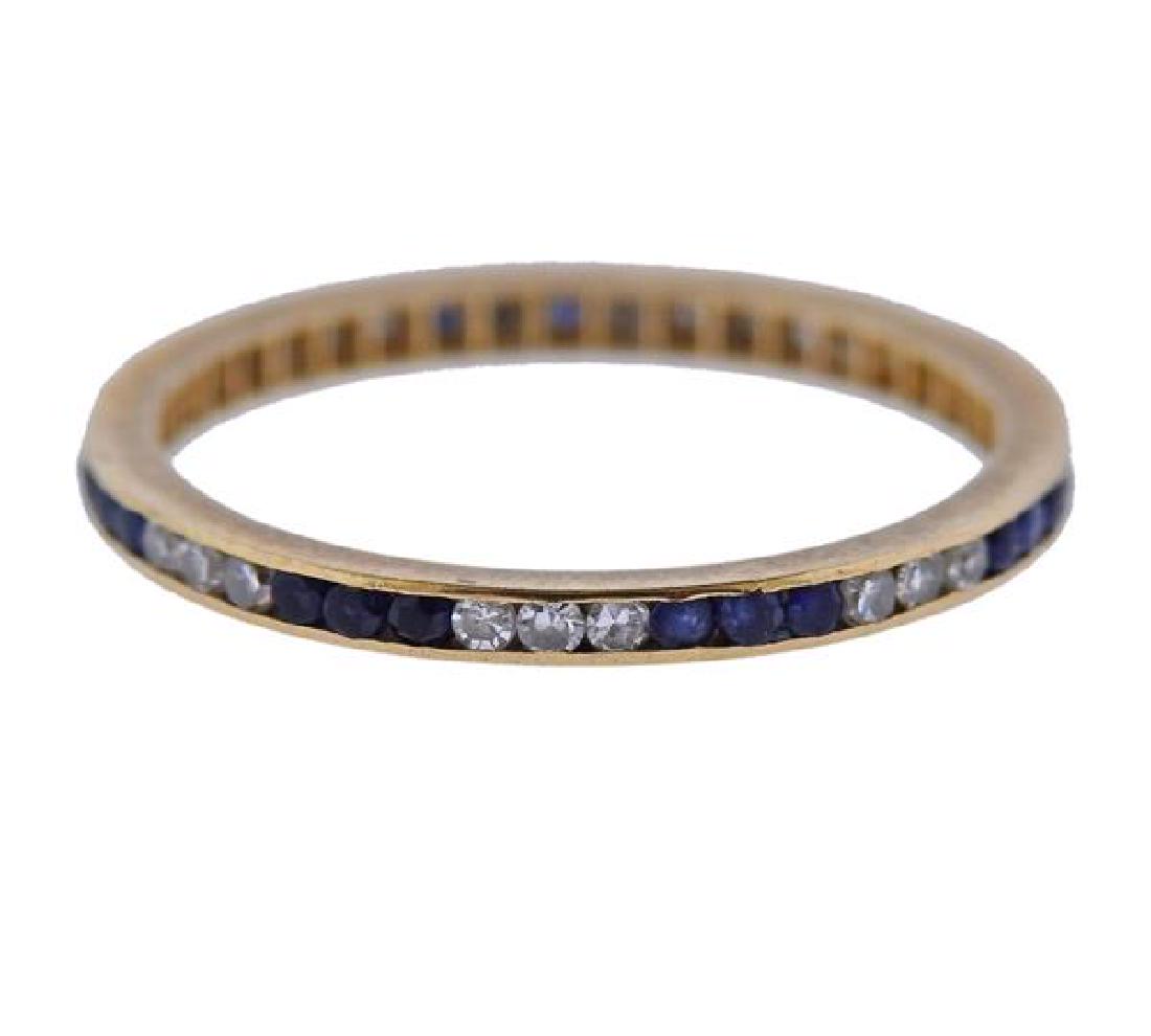14K Gold Diamond Blue Stone Eternity Band Ring: METAL: 14K gold. GEMSTONES: diamonds, blue stones (stones abraded). MEASUREMENTS: ring size 7. Band is 1.5mm wide. TESTED: 14K. WEIGHT: 1.2 grams.Gemstones have not been graded for color and clarity ,