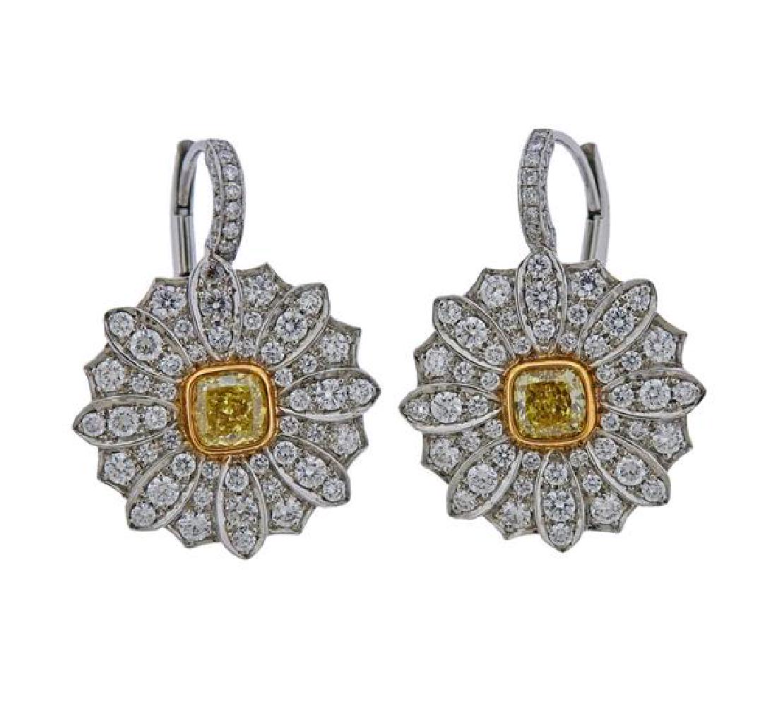 Tiffany & Co Daisy Platinum Gold Yellow Diamond: METAL: 18k Gold/ Platinum. MEASUREMENTS: Earrings are 25mm x 16mm. GEMSTONES: White diamonds - approx. 1.12ctw, Yellow diamonds - approx. 0.37-0.39ct each. MARKED: pt950, 31756626, T & Co, Au750. 