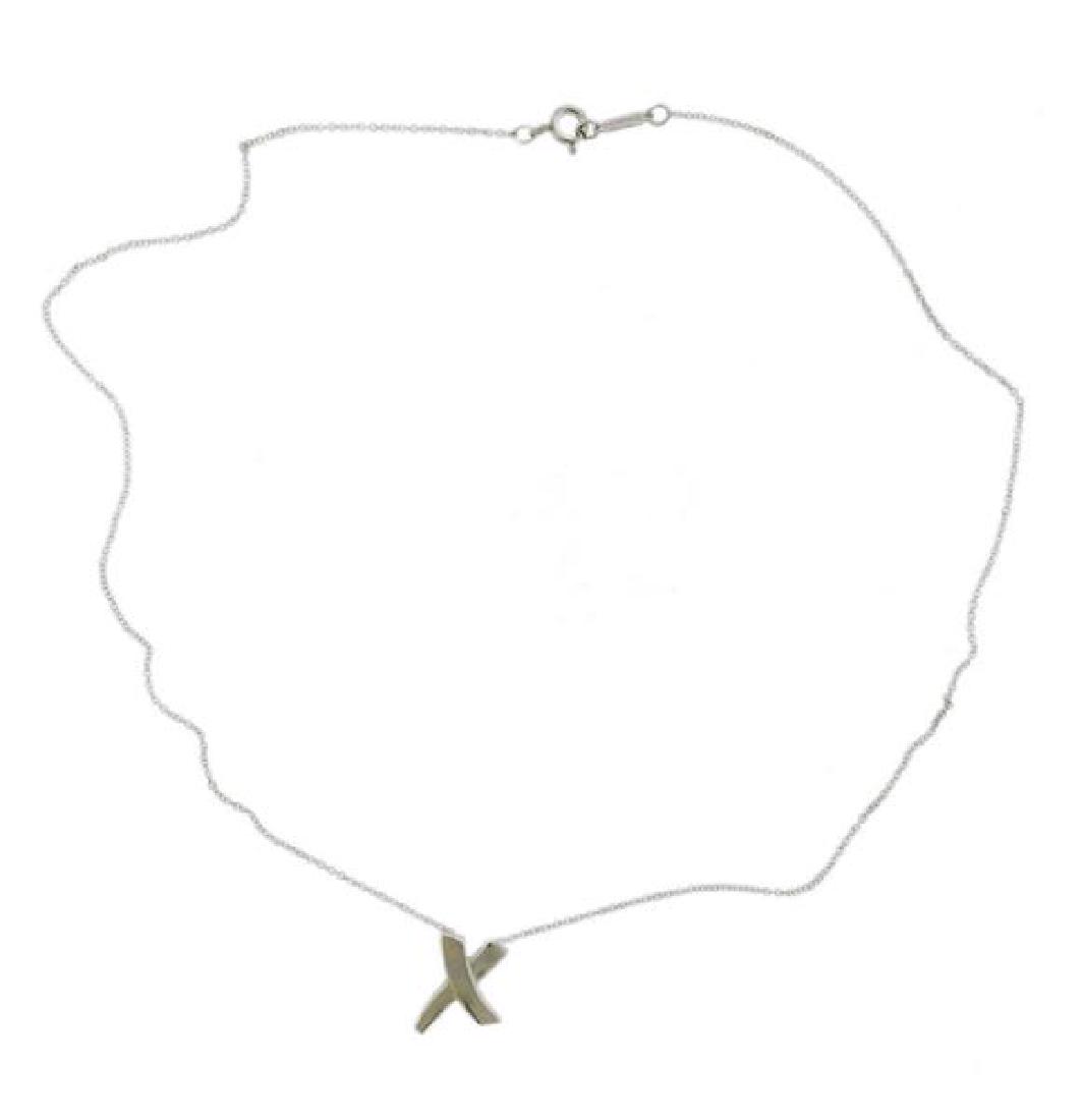 Tiffany & Co Paloma Picasso Sterling X Pendant: METAL: sterling silver. MEASUREMENTS: necklace is 16" long. X pendant is 16.5 x 12mm. MARKED: Tiffany & Co Paloma Picasso 925. WEIGHT: 2.3 grams. Comes with pouch.Gemstones have not been grad