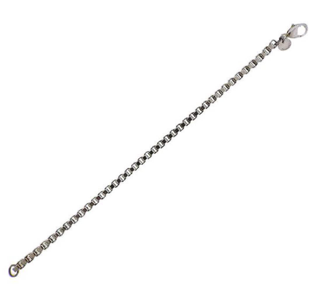 Tiffany & Co Sterling Silver Box Chain Bracelet: METAL: sterling silver. MEASUREMENTS: bracelet is 7.5" long x 4mm wide. MARKED: Tiffany & Co 925. WEIGHT: 16.1 grams. Comes with pouchGemstones have not been graded for color and clarity ,and