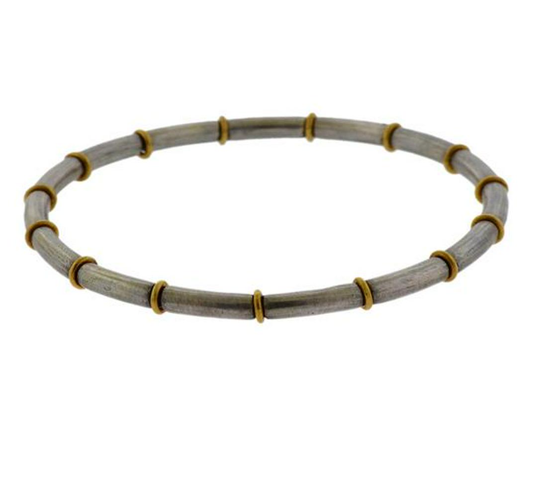 Gurhan Midnight 24K Gold Sterling Silver Bracelet: METAL: 24K gold, sterling silver. MEASUREMENTS: Bracelet is 65mm in diameter and is 4mm wide. MARKED: Gurhan, BO602/AG925/0.999. WEIGHT: 26.5 grams. Retail $1500.Gemstones have not been graded for col