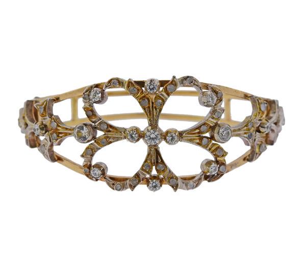 18K Gold Silver Diamond Clear Stone Bracelet: METAL: 18k gold. Silver. GEMSTONE: Rose cut diamonds and Round clear stones. MEASUREMENTS: Bracelet will fit 6" wrist and is 24mm at widest point. TESTED: 18k. WEIGHT: 25.7 grams.Gemstones have n