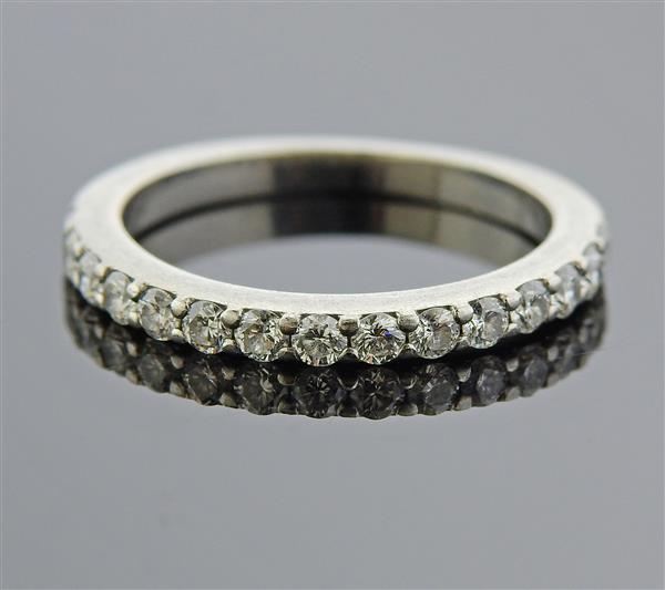Platinum Diamond Wedding Band Ring: METAL: Platinum. GEMSTONES: Diamonds approx. 0.45ctw. MEASUREMENTS: Ring size 5 1/4, ring band is 2mm wide. MARKED: Plat marker's mark. WEIGHT: 3.7 grams.Gemstones have not been graded for color a
