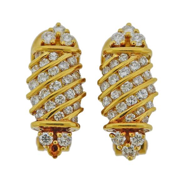 Piaget 18k Gold Diamond Earrings: METAL: 18k Gold. MEASUREMENTS: Earrings are 19mm x 8mm. GEMSTONES: Diamonds approx. 0.80ctw (one is missing). MARKED: Piaget, Gold marks. WEIGHT: 7.7 grams.Gemstones have not been graded for color and